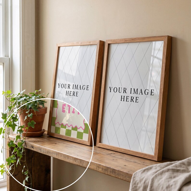 May include: Two framed prints with wooden frames, each displaying the text "YOUR IMAGE HERE" on a white background with a diamond pattern. One print features a colorful graphic with the text "ETA". A potted plant sits on a wooden shelf.