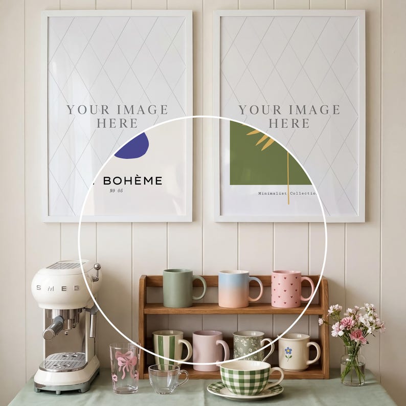 May include: A display of mugs, cups, and a teacup set on a wooden shelf and table. The mugs are in various colors, including green, pink, and blue. A white espresso machine is on the left. Two framed art prints hang on the wall.