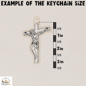 May include: An example of a keychain size is shown. The image features a black and gold outline of Jesus on a cross. A ruler shows the keychain is approximately 3 inches in height. The text "EXAMPLE OF THE KEYCHAIN SIZE" is at the top.