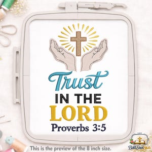 May include: An embroidery design featuring a cross with sun rays, held by two hands, and the words "Trust IN THE LORD Proverbs 3:5". The design is in a white embroidery hoop. The preview size is 8 inches.