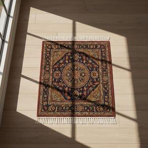 May include: A square, ornate rug with a central medallion design. The rug features a navy blue background with intricate patterns in shades of red, gold, and green. It has a red border and white fringe.