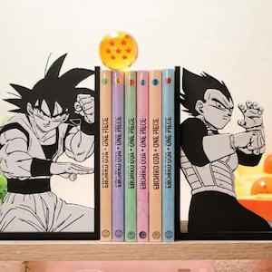 May include: A collection of One Piece manga volumes, numbers 6 to 10, held between Goku and Vegeta character bookends. A clear sphere with stars sits above the books. The book spines are pastel colours.