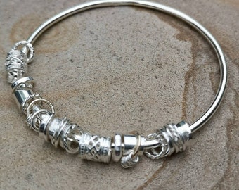 Brazalete de plata de ley con hilanderos