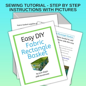 May include: A green and white fabric rectangle basket with a floral pattern. The basket is shown on a white page with the text "Easy DIY Fabric Rectangle Basket by Joan Begin JMB Handmade".