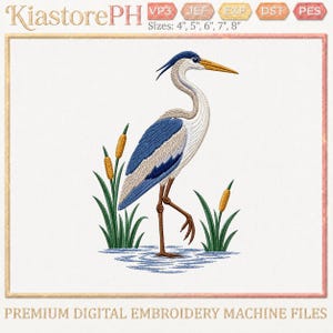 May include: An embroidery design featuring a blue and white heron standing in water with green cattails. The text KiastorePH is at the top, with file formats VP3, JEF, EXP, DST, PES and sizes 4", 5", 6", 7", 8" listed. The bottom text reads PREMIUM DIGITAL EMBROIDERY MACHINE FILES.