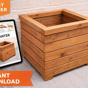 May include: A square wooden planter with a natural finish. The planter is constructed from horizontal wooden planks and has a rectangular opening at the top. A tablet displays a digital image of the planter with the word "PLANTER".
