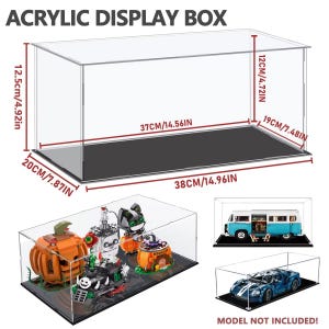 May include: Clear acrylic display box, measuring 38cm long, 20cm wide, and 12.5cm high. The box has a black base and is designed to showcase collectibles. The text "ACRYLIC DISPLAY BOX" is at the top.