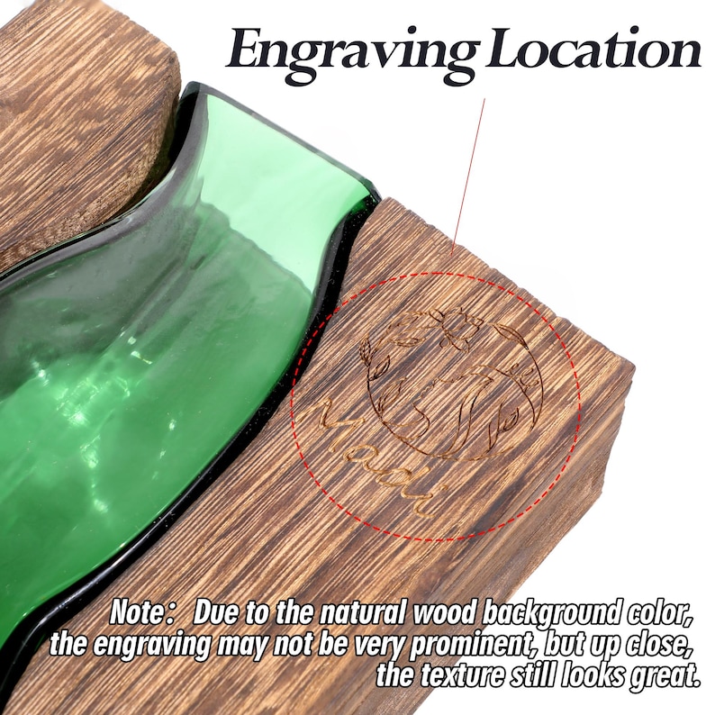 May include: A wooden block with an engraved design, next to a green glass object. The text "Engraving Location" is at the top. The note at the bottom says the engraving may not be very prominent due to the wood colour.