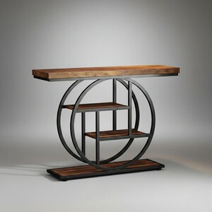 May include: A modern console table with a rectangular wooden top and base. The table features a black metal circular frame with three shelves and a geometric design. The wood has a warm, natural finish.
