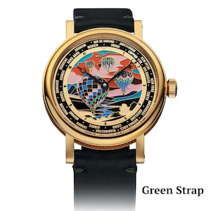 Green strap on wrist watch