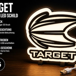 Könnte beinhalten: Ein 3D-gedrucktes LED-Schild mit dem Target-Logo, einer weiß leuchtenden Grafik und schwarzem Rand. Das Schild verfügt über ein USB-Stromkabel mit Schalter. Der Text lautet TARGET 3D DRUCK LED SCHILD, 3D DRUCK, LED BELEUCHTUNG, USB BETRIEBEN, IDEALES GESCHENK, PERFEKT FÜR FANS und CA. 25 CM.