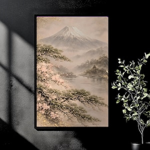 May include: A framed landscape painting depicts a misty mountain scene with a snow-capped peak. Cherry blossoms and evergreen trees frame a lake and distant structures. The artwork has a soft, muted color palette.