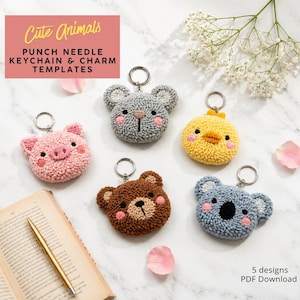 May include: Five punch needle keychain and charm templates featuring animal designs: a pink pig, grey mouse, yellow chick, brown bear, and blue koala. The text "Cute Animals" is displayed at the top. The designs are for PDF download.