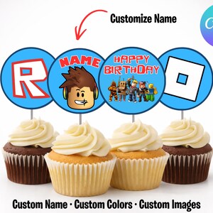 May include: Four cupcakes with white frosting, each topped with a blue circle featuring Roblox-themed graphics and text. The text includes "Customize Name" and "Happy Birthday". The bottom of the image reads "Custom Name &bull; Custom Colors &bull; Custom Images".