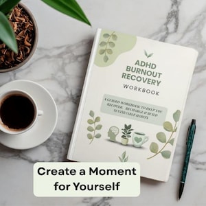 May include: A white workbook titled ADHD BURNOUT RECOVERY WORKBOOK with a subtitle A GUIDED WORKBOOK TO HELP YOU RECOVER, RECHARGE & BUILD SUSTAINABLE HABITS. The cover features green leaf illustrations, a brain icon, a plant, and a mug.