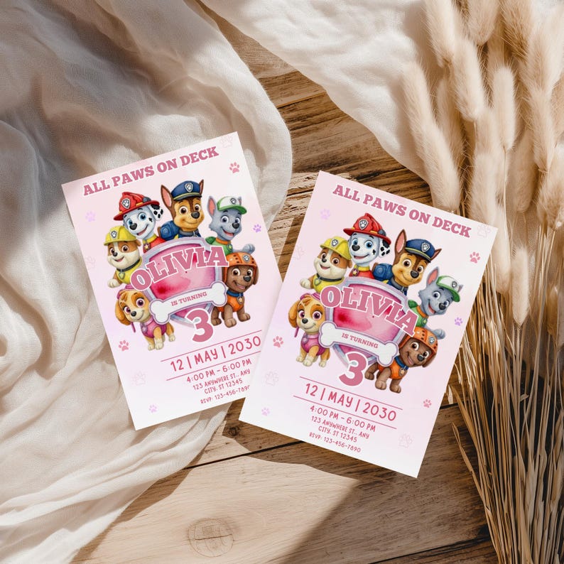 May include: Two pink birthday party invitations with the text "ALL PAWS ON DECK" and "OLIVIA IS TURNING 3". The invitations feature cartoon images of the Paw Patrol characters and paw prints.