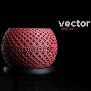 May include: A spherical red planter featuring a complex, repeating geometric lattice pattern across its surface. The text "vector planter" is printed in white and red in the upper right corner against a solid black background.