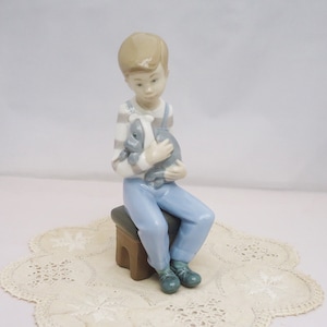 Lladro boy sitting with cheap dog