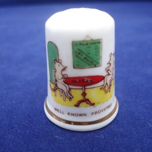 Fenton China Thimble, Fenton &quot;Well Known Proverbs&quot; Thimble &quot;While the cats away the mice will play&quot;