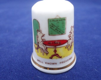 Fenton China Thimble, Fenton &quot;Well Known Proverbs&quot; Thimble &quot;While the cats away the mice will play&quot;
