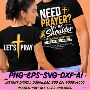 Puede incluir: Camisetas negras con texto y gráficos religiosos. Una camiseta dice "LET'S PRAY" con una cruz dorada. La otra dice "NEED PRAYER? TAP MY Shoulder" con manos rezando y una cruz. Incluye una cita de Mateo 18:20.