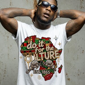 May include: White t-shirt with a colorful African continent graphic and the text "do it for the CULTURE". The design includes bedazzled lettering and handcuffs. The shirt also features the text "EST. 1865".