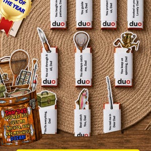 May include: A collection of Father's Day gift tags with fishing-themed illustrations and messages like "You taught me patience, Dad." The tags are arranged on a woven surface, with a "Dad of the Year" tag.