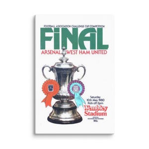 May include: Canvas print of a vintage football poster. The poster features a silver trophy, orange and purple ribbons, and text that reads "FINAL ARSENAL WEST HAM UNITED Wembley Stadium." The date is May 10th, 1980.