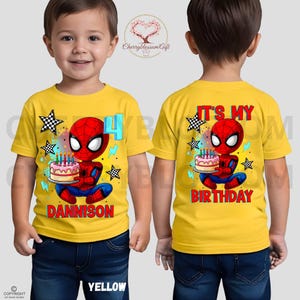 May include: Yellow t-shirt featuring a cartoon Spider-Man holding a birthday cake with candles. The front of the shirt has the number 4 and the name "DANNISON". The back of the shirt says "IT'S MY BIRTHDAY".