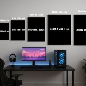 May include: Six rectangular black wall art frames of varying sizes labeled with dimensions including 21x29.7 cm / 8x12, A3 (29.7 x 42 cm), A2 (42 x 59.4 cm), 50x70 cm / 20x28, A1 (59.4 x 84.1 cm), and 70x100 cm / 28x40, displayed above a computer desk.