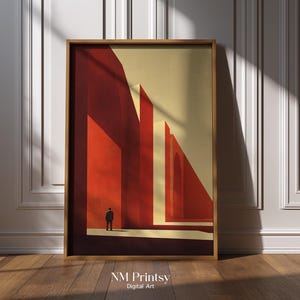 May include: Framed art print featuring an abstract architectural design in shades of red and beige. A small figure stands in the foreground, adding a sense of scale. The print is in a wooden frame and is labeled "NM Printsy Digital Art."