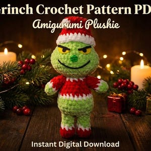 May include: A crocheted Grinch plushie wearing a red and white Santa hat and matching outfit. The Grinch has a green body, yellow eyes, and a mischievous expression. The image includes text that reads "Grinch Crochet Pattern PDF Amigurumi Plushie" and "Instant Digital Download."