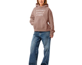Apoya el deporte femenino. Sudadera con capucha holgada para mujer.