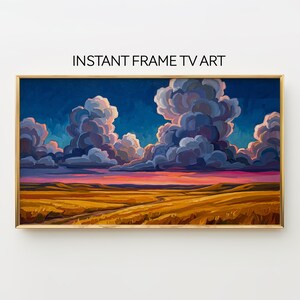 May include: A framed landscape painting with a golden frame. The artwork depicts a field of golden grass under a sky filled with large, fluffy clouds. The text "INSTANT FRAME TV ART" is at the top.
