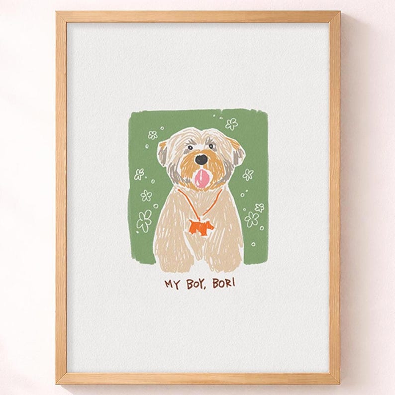 May include: A framed art print featuring a tan dog with a pink tongue, wearing an orange collar with a dog-shaped charm. The dog is set against a green background with white flower outlines. The text MY BOY, BORI is printed below the illustration.