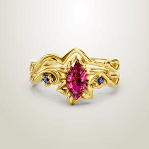 May include: A white ceramic mug with a black handle and the text "But first, coffee" in a handwritten style. The mug is on a white surface. The mug is approximately 4 inches tall.