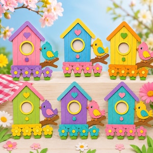 May include: A selection of brightly coloured birdhouses in shades of pink, blue, yellow, green, purple, and teal. Each birdhouse has a circular opening, a heart-shaped detail, and a decorative bird on a branch. Flower accents are at the base.