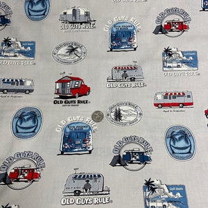 May include: A white fabric with a repeating pattern of vintage camper vans, trucks, and palm trees. The pattern includes the text "Old Guys Rule" with various slogans.