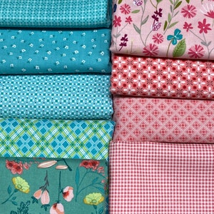 May include: A stack of eight fabric squares in various patterns. The fabrics are in shades of pink, blue, and green. The patterns include floral, polka dot, gingham, and geometric designs.