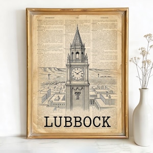 May include: Framed print featuring a black and white illustration of a clock tower with the word "LUBBOCK" at the bottom. The artwork is set against a vintage book page background, framed in gold.
