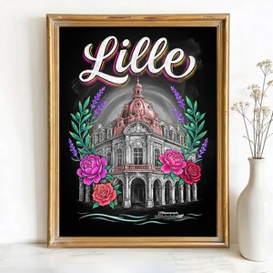 May include: Framed art print featuring a detailed illustration of a building in Lille, France, with a pink dome and white facade. The word "Lille" is written in a colorful, stylized font above the building. The artwork is framed in a gold-colored frame, with floral accents.