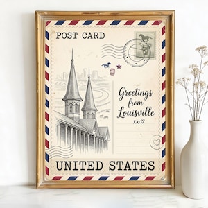 May include: Framed vintage postcard print with a gold border. The postcard features a detailed black and white illustration of a building with two spires, with the text "Greetings from Louisville" and "United States". Decorative elements include stamps and a heart.