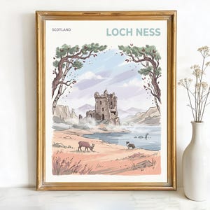 May include: Framed art print featuring a scenic illustration of Loch Ness in Scotland. The artwork depicts a castle, lake, and the Loch Ness Monster, with the text "LOCH NESS" and "SCOTLAND". The print is in a gold frame.