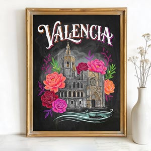 May include: Framed art print featuring the word "Valencia" in ornate lettering above a detailed illustration of a building, surrounded by colorful flowers. The artwork is set against a black background and framed in gold.