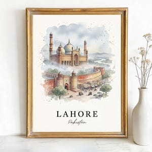 May include: Watercolor print of Lahore, Pakistan, in a gold frame. The artwork depicts a detailed illustration of a mosque and surrounding buildings in shades of brown, red, and beige. The word "LAHORE" and "Pakistan" are printed at the bottom.