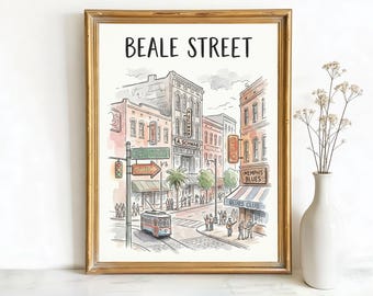 May include: A framed watercolour print of Beale Street, Memphis, Tennessee. The artwork shows a street scene with buildings, a tram, and people. The text "BEALE STREET" is at the top, framed in gold.