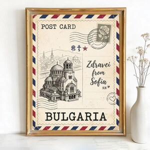 May include: Framed vintage postcard print featuring a detailed illustration of a cathedral in Sofia, Bulgaria. The postcard design includes the text "POST CARD", "Zdravei from Sofia", and "BULGARIA", with decorative stamps and borders.