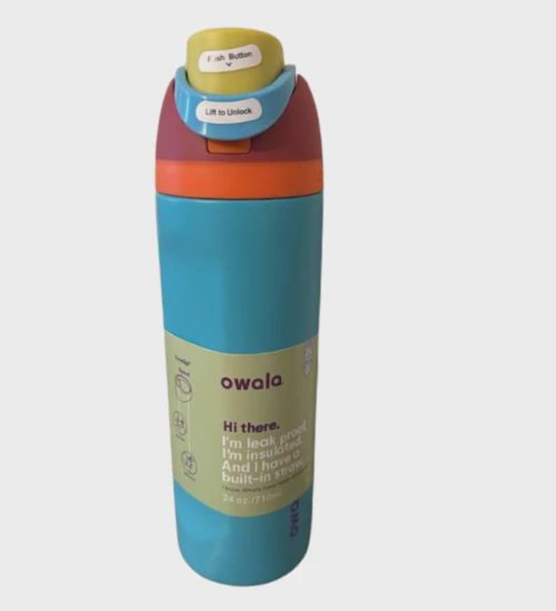 May include: A multi-colored Owala water bottle with a teal body, orange ring, and a maroon lid featuring a yellow push button and light blue lock. The label reads: Hi there. I'm leak proof. I'm insulated. And I have a built-in straw. 24 oz / 710ml.