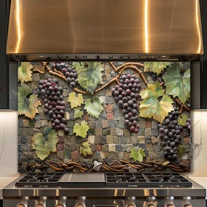 May include: A decorative kitchen backsplash featuring a mosaic stone background with a 3D relief of grape vines. The grapes are a deep purple, and the leaves are green and yellow. The backsplash is installed above a stainless steel range.