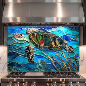 May include: A rectangular kitchen backsplash panel featuring a stained glass style illustration of a sea turtle swimming through blue ocean waves. The turtle has a multi-colored shell with brown, green, and blue tones, set against a vibrant aquatic background with coral-like structures at the bottom.